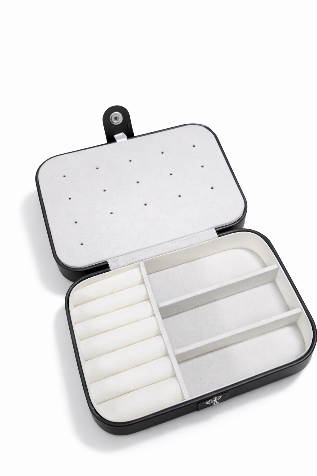 Open jewelry case with compartments on a white background